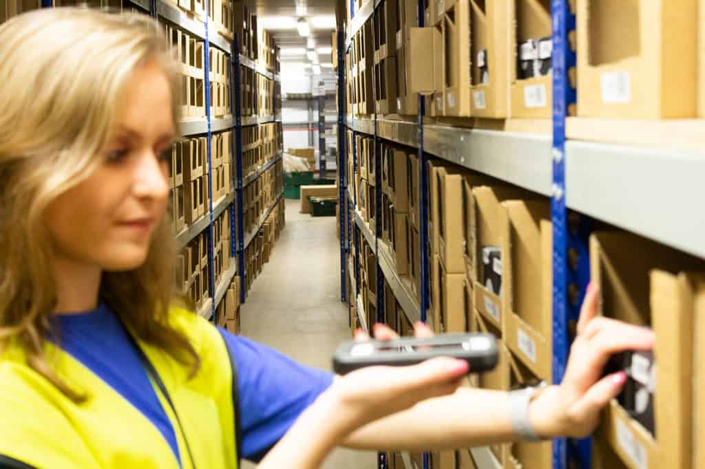 Warehouse employee scanning ecommerce fulfilment stock